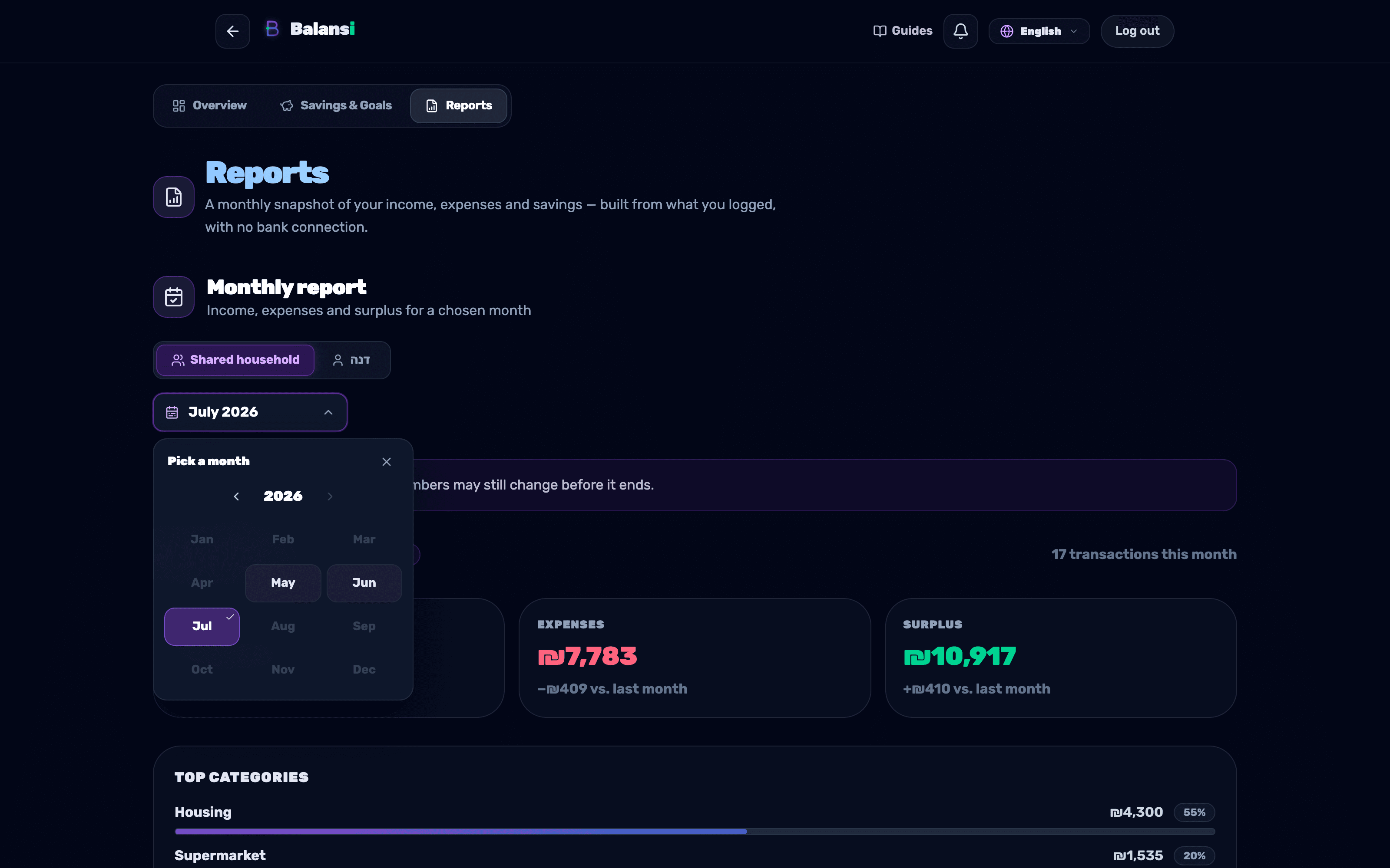 The month picker panel open above the monthly report with a grid of 12 months